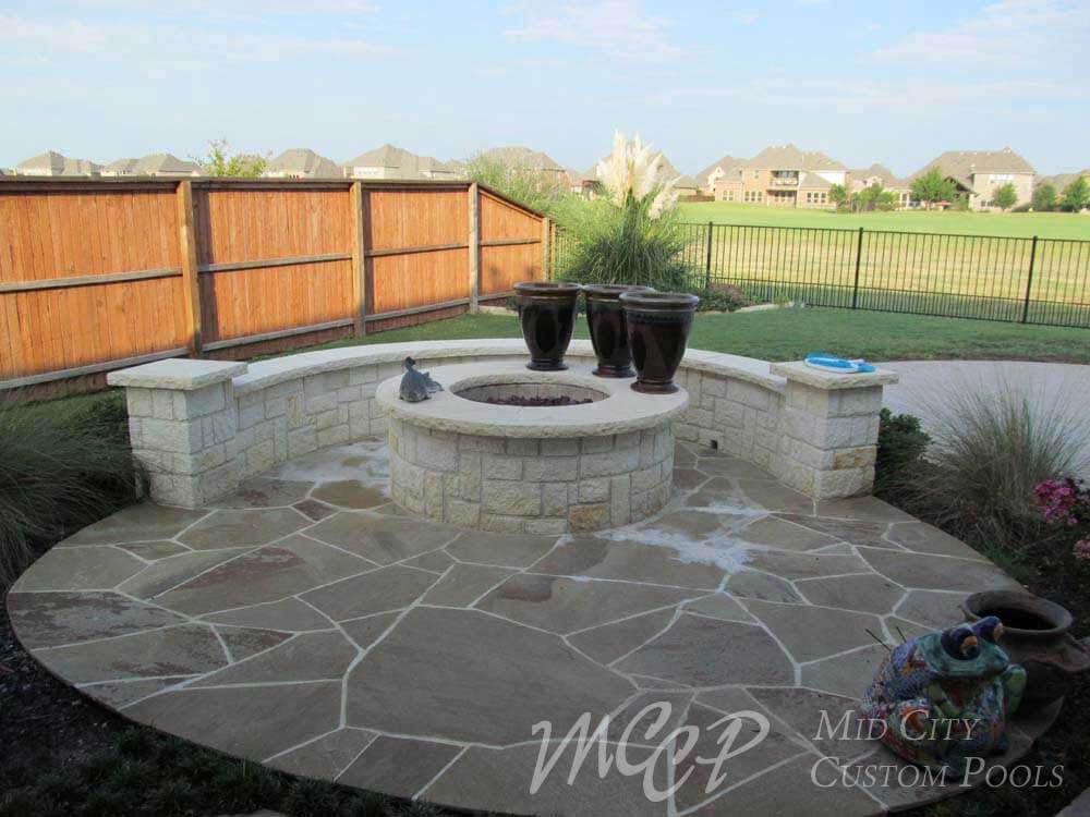 Vyce-6-Oklahoma-Flagstone-Coping-2-5-ton-waterfalls-with-1-ton-jump-rock-Chrystal-Stones-Aqua-Blue-interior-Exposed-Aggregate-decking-with-12-La